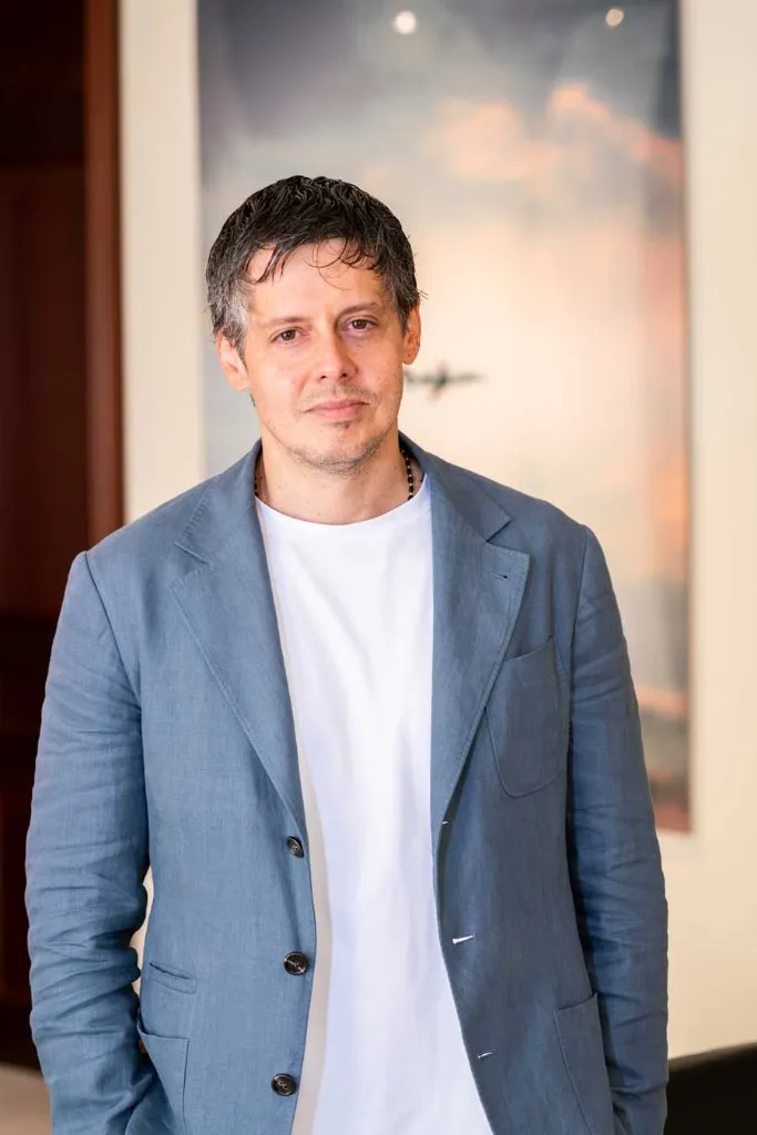 Professional advisor in a light blazer, portrait indoors